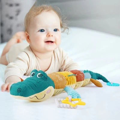 hochet crocodile bebe ventre plat