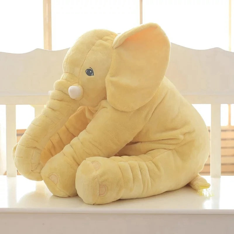peluche elephant geant jaune assis banc
