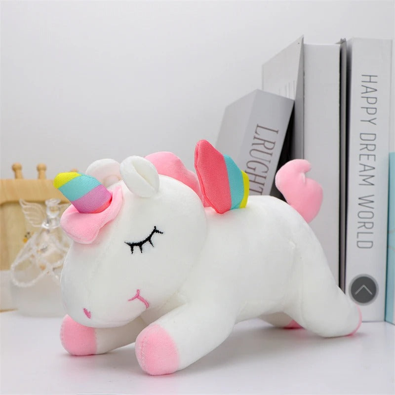 peluche licorne blanche sur presentoire