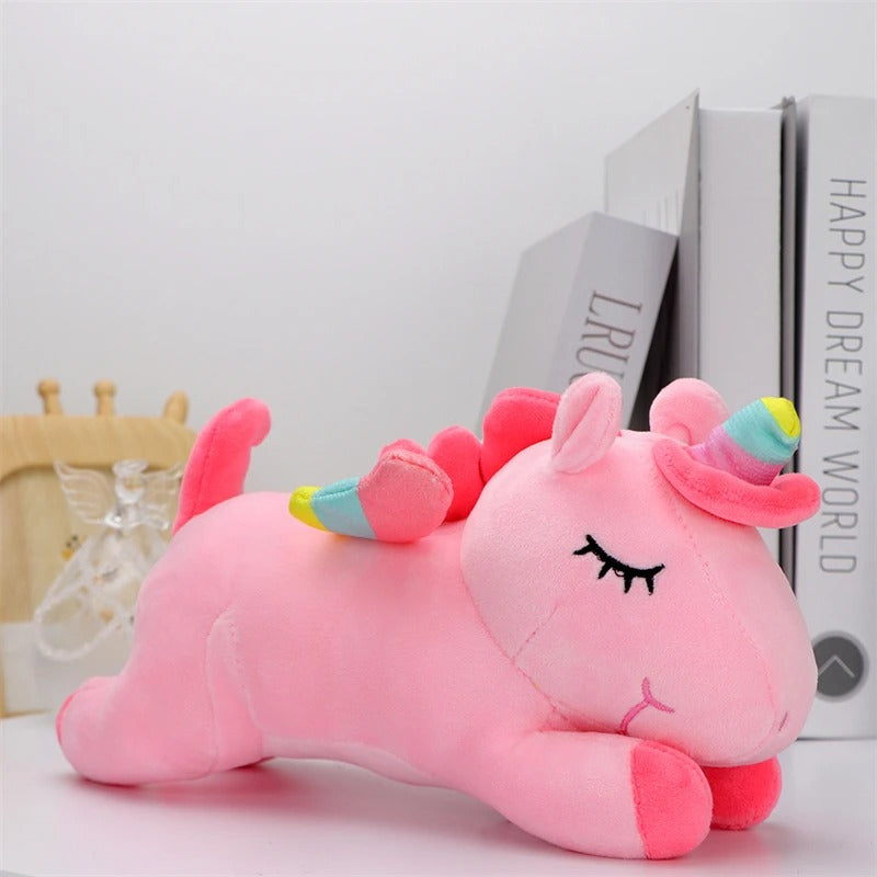 peluche licorne rose sur presentoire