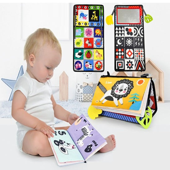 bebe assis regarde livre tissu bebe-jaune