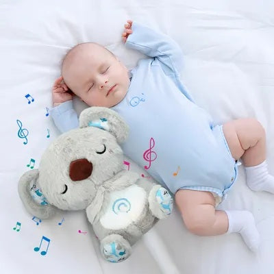 bebe dort avec peluche bruit blanc koala