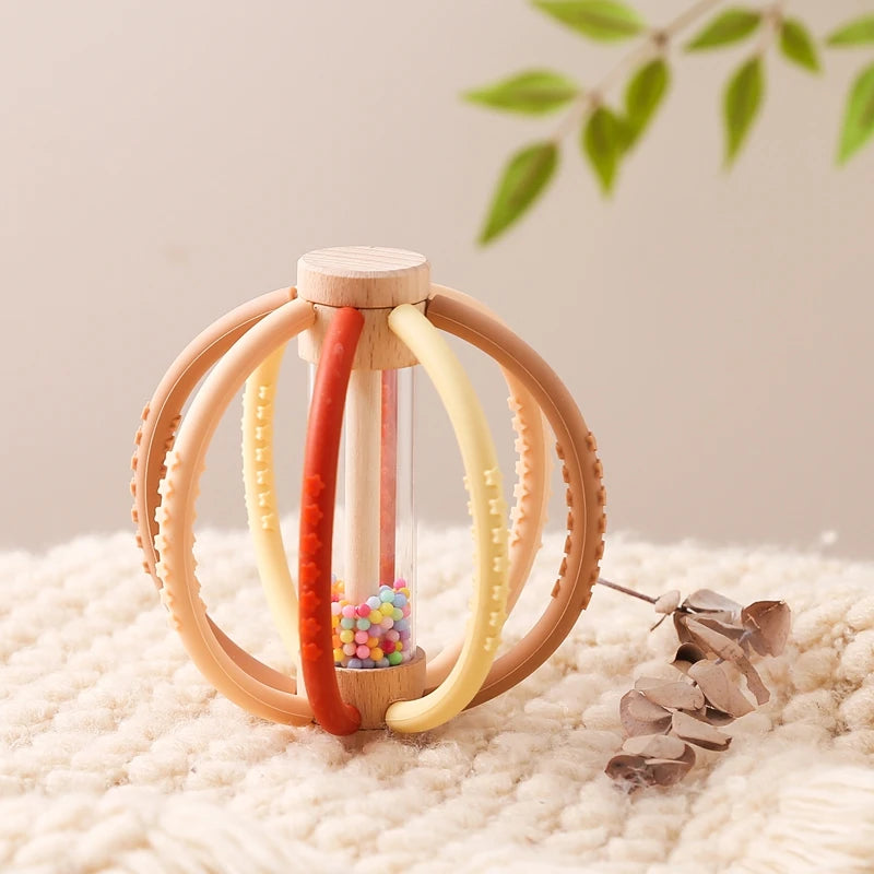 hochet pour bebe sphere rouge marron