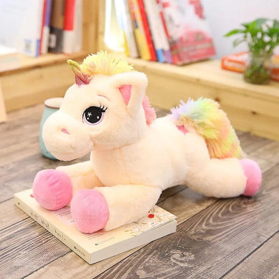 licorne peluche rose arc en ciel sur parquet