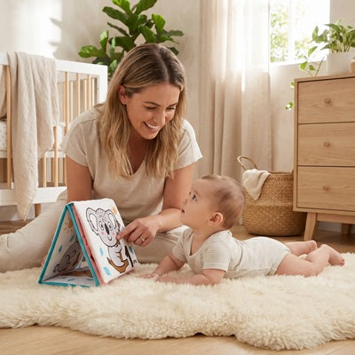 maman bebe tummy time tapis devant livre bebe en tissus
