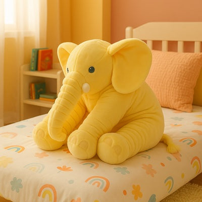 peluche elephant geant jaune sur lit enfant