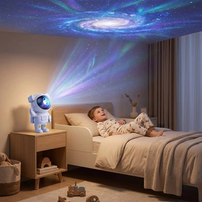 petit garçon pyjama souriant regarde cosmos plafond veilleuse projection bebe
